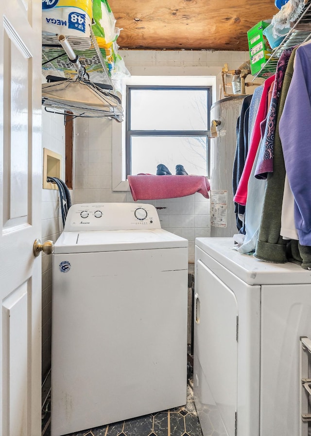 washroom featuring washer and dryer and laundry area