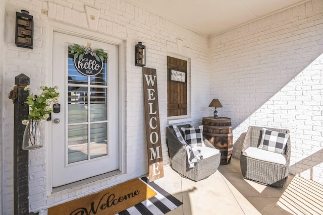 entrance to property with brick siding