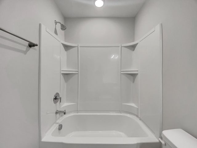 full bathroom featuring toilet and washtub / shower combination