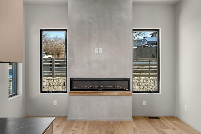 unfurnished living room featuring wood finished floors