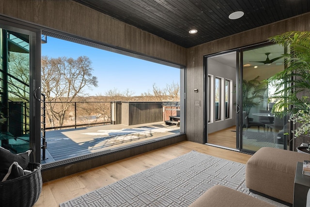 sunroom / solarium featuring wood ceiling