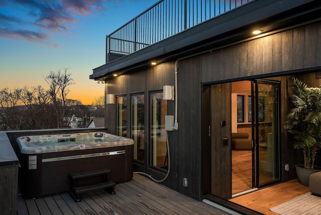 deck featuring a hot tub