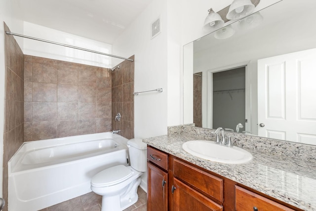 bathroom with vanity, visible vents, bathtub / shower combination, tile patterned flooring, and toilet