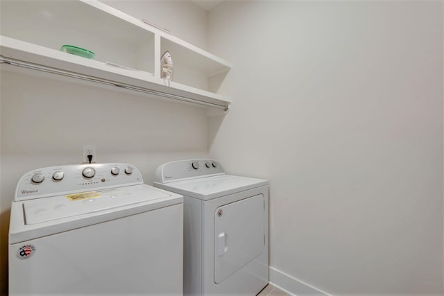 clothes washing area with laundry area and separate washer and dryer