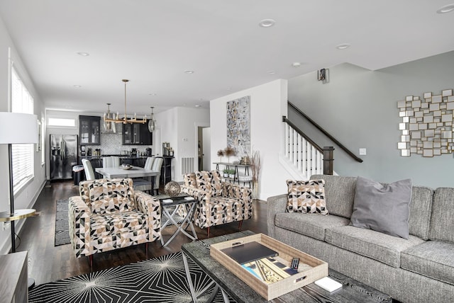 living area featuring recessed lighting, stairway, and dark wood-type flooring