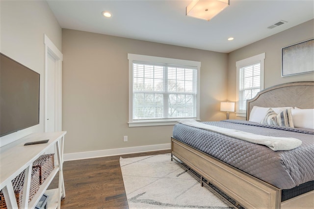 bedroom featuring dark wood finished floors, recessed lighting, baseboards, and visible vents