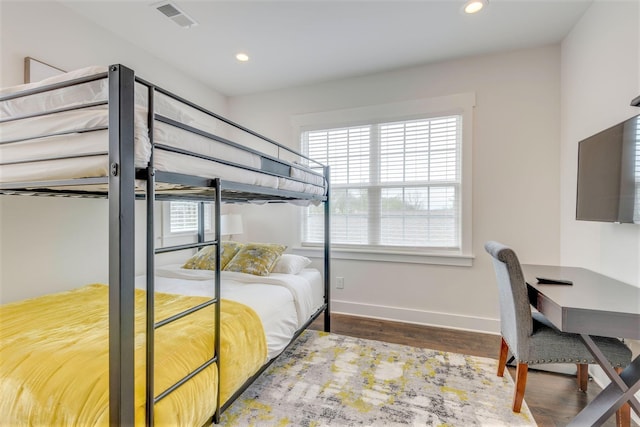 bedroom featuring visible vents, recessed lighting, baseboards, and wood finished floors