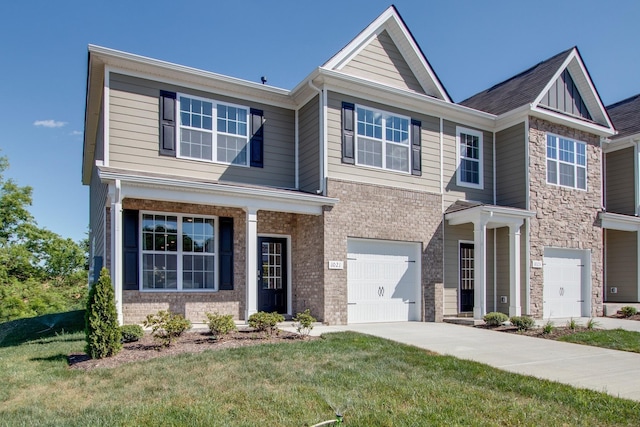 view of front of house with a garage, brick siding, concrete driveway, and a front lawn