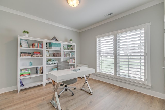 office with baseboards, light wood-style floors, and ornamental molding