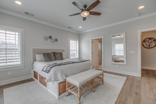 bedroom with wood finished floors, baseboards, ornamental molding, and recessed lighting