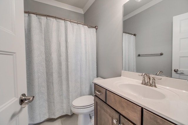 bathroom featuring toilet, vanity, and crown molding