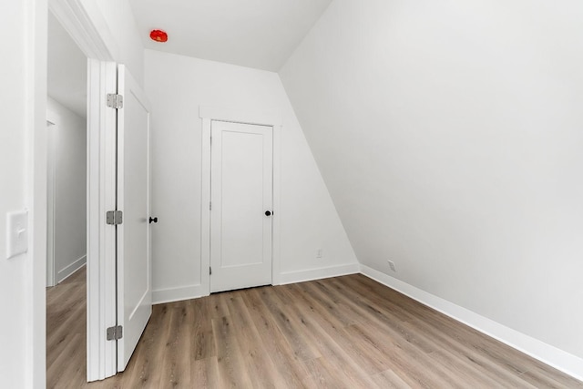 unfurnished bedroom with light wood-type flooring and baseboards