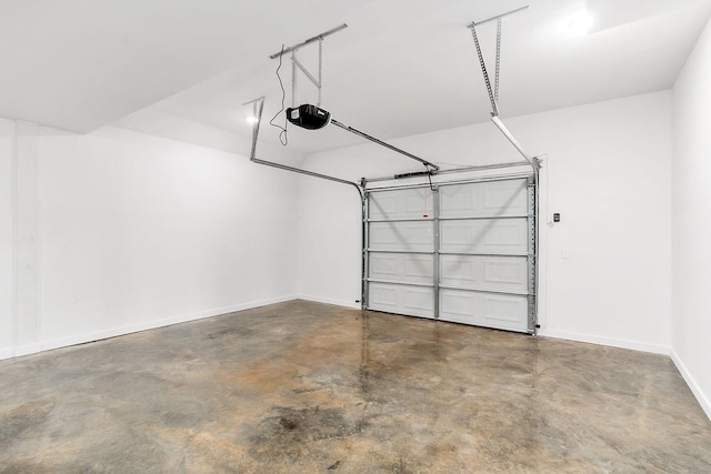 garage featuring baseboards and a garage door opener