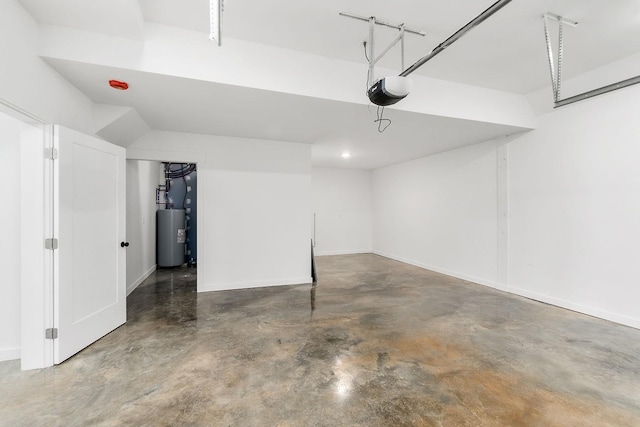 garage with a garage door opener, baseboards, and water heater