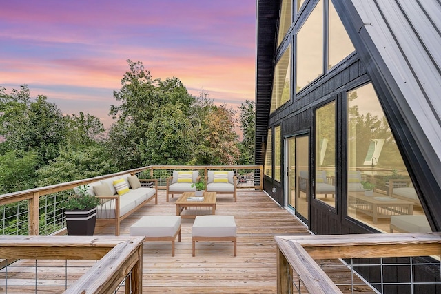 wooden terrace featuring an outdoor living space