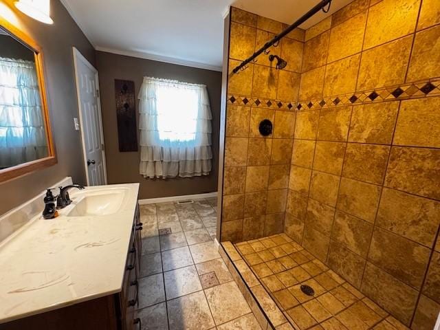 full bathroom featuring vanity and a tile shower