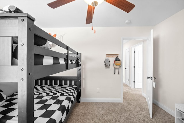 bedroom with baseboards, a ceiling fan, and carpet flooring