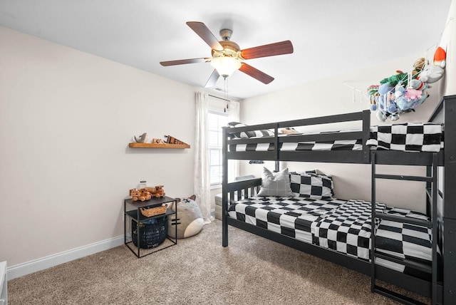 carpeted bedroom featuring a ceiling fan and baseboards