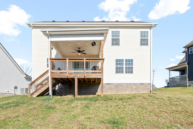 back of house featuring ceiling fan, stairway, a wooden deck, a lawn, and crawl space