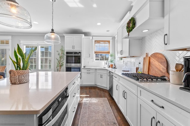 kitchen featuring white cabinetry, light countertops, dark wood-style flooring, and stainless steel appliances