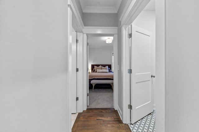 corridor featuring crown molding and wood finished floors