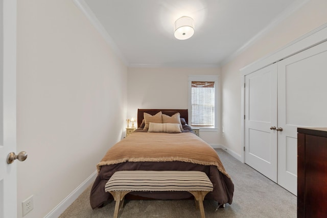 carpeted bedroom with baseboards and crown molding