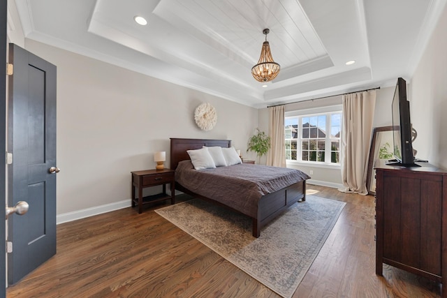 bedroom featuring a raised ceiling, dark wood-style floors, recessed lighting, an inviting chandelier, and baseboards