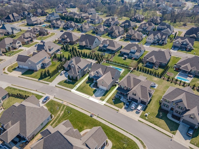 birds eye view of property with a residential view