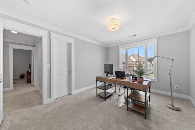 office area featuring visible vents, baseboards, carpet flooring, and crown molding