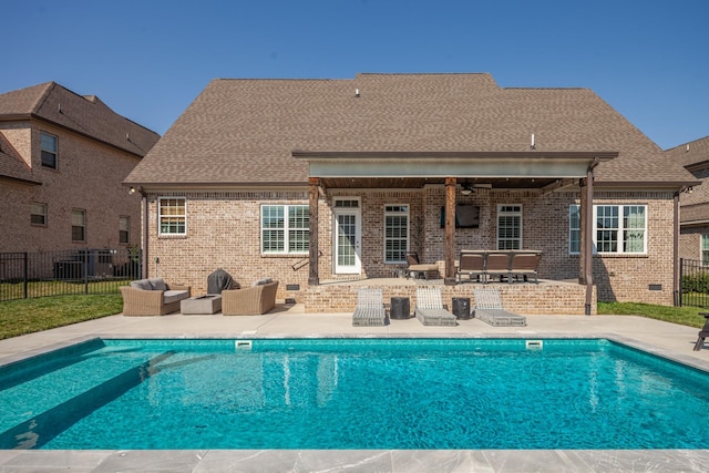 view of swimming pool featuring a fenced in pool, ceiling fan, fence, outdoor lounge area, and a patio area