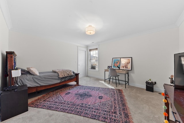 carpeted bedroom with baseboards and ornamental molding