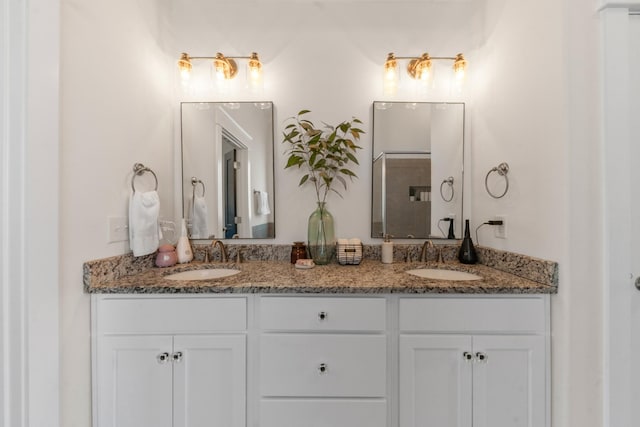 bathroom featuring double vanity and a sink