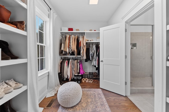 spacious closet with visible vents and wood finished floors