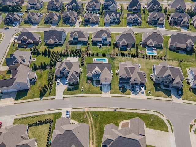 birds eye view of property with a residential view