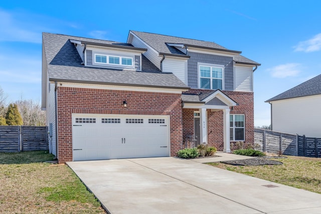 view of front of property featuring a front lawn, fence, concrete driveway, an attached garage, and brick siding