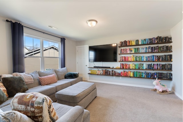 carpeted living room with baseboards and visible vents