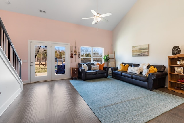 living area featuring visible vents, dark wood-type flooring, high vaulted ceiling, baseboards, and ceiling fan