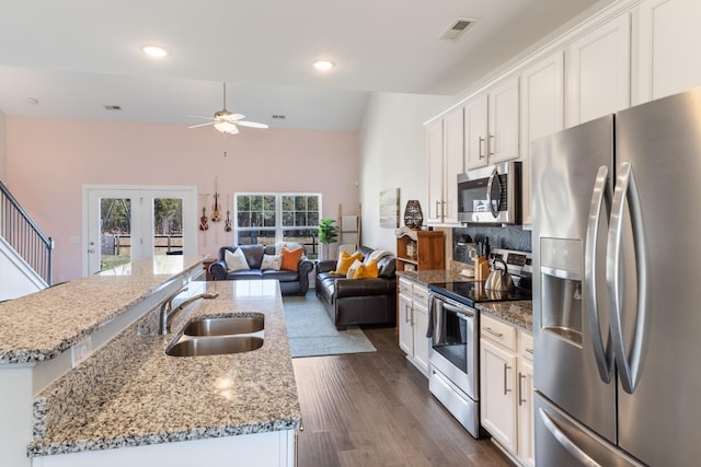 kitchen with visible vents, ceiling fan, a sink, french doors, and appliances with stainless steel finishes