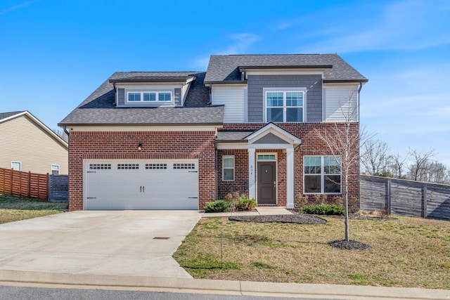 view of front of property featuring a front lawn, concrete driveway, fence, and brick siding