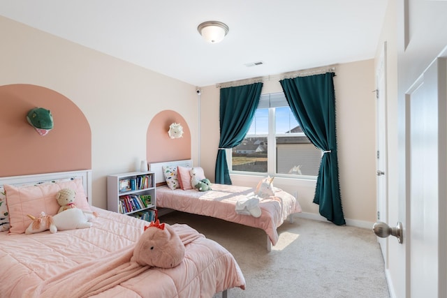 bedroom featuring visible vents, carpet floors, and baseboards