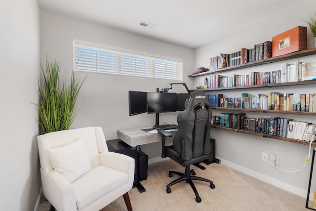 carpeted office space with visible vents and baseboards