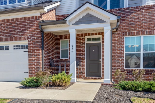 doorway to property with brick siding