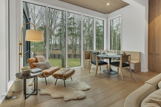 sunroom / solarium featuring a healthy amount of sunlight