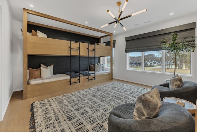 living room featuring recessed lighting, baseboards, and wood finished floors