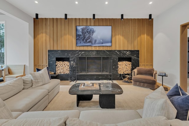 living room featuring recessed lighting, a fireplace, and baseboards