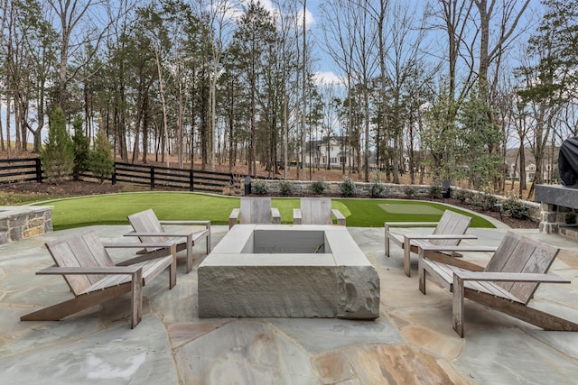 view of patio / terrace featuring a fire pit and fence