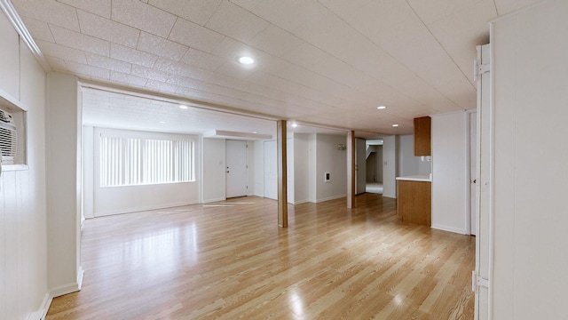 basement with recessed lighting, baseboards, and light wood-style floors