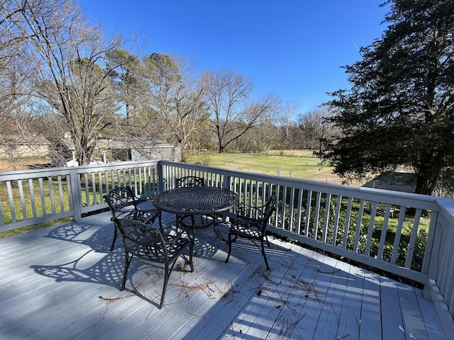 wooden deck with outdoor dining area