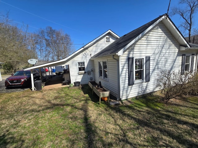 view of property exterior with a lawn