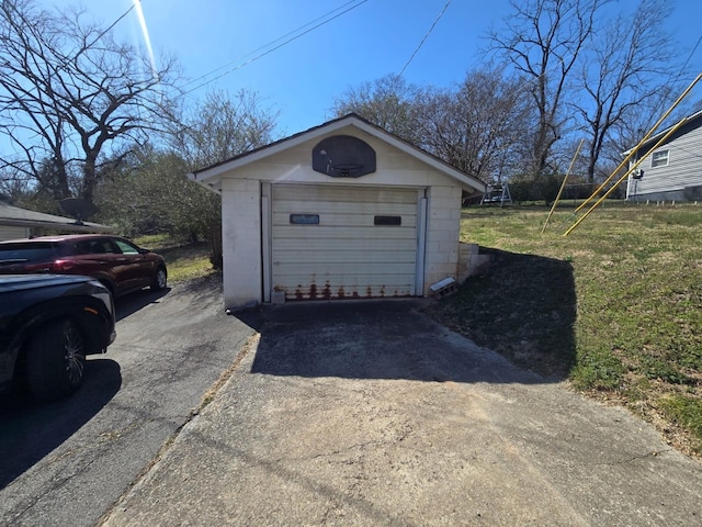 detached garage with aphalt driveway